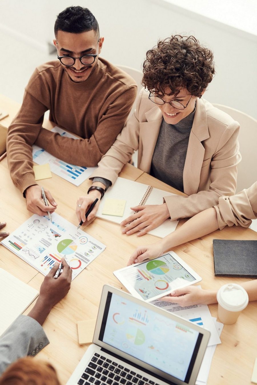 An overhead shot of four people at a meeting.